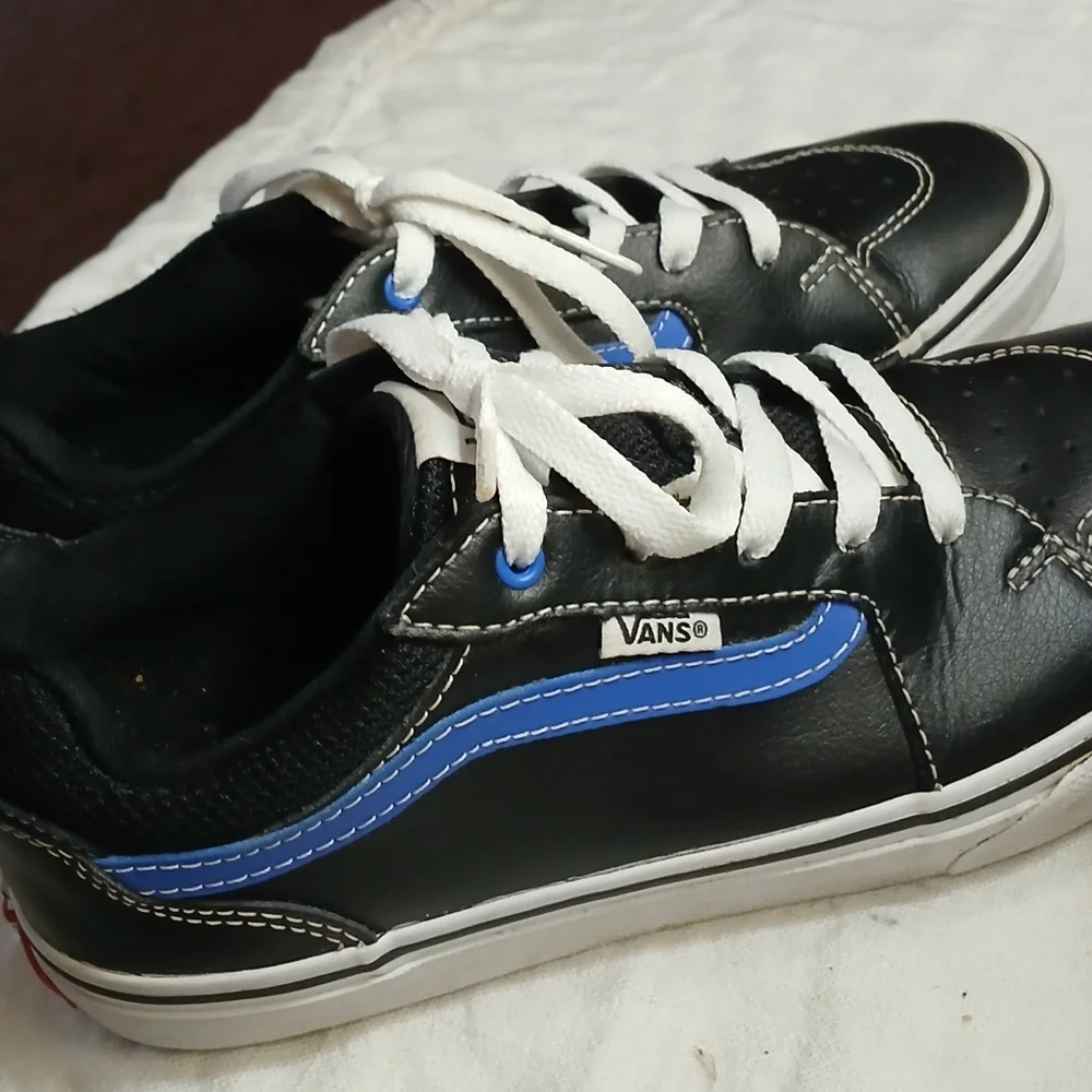 Vans Black Sneakers with Blue Accents and White Laces